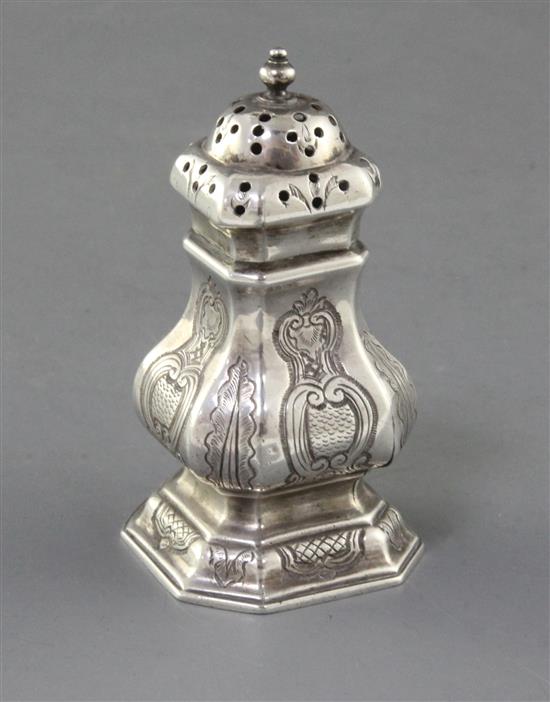 A George I Britannia standard silver pepper of square baluster form with engraved decoration, Edward Wood, 89mm.